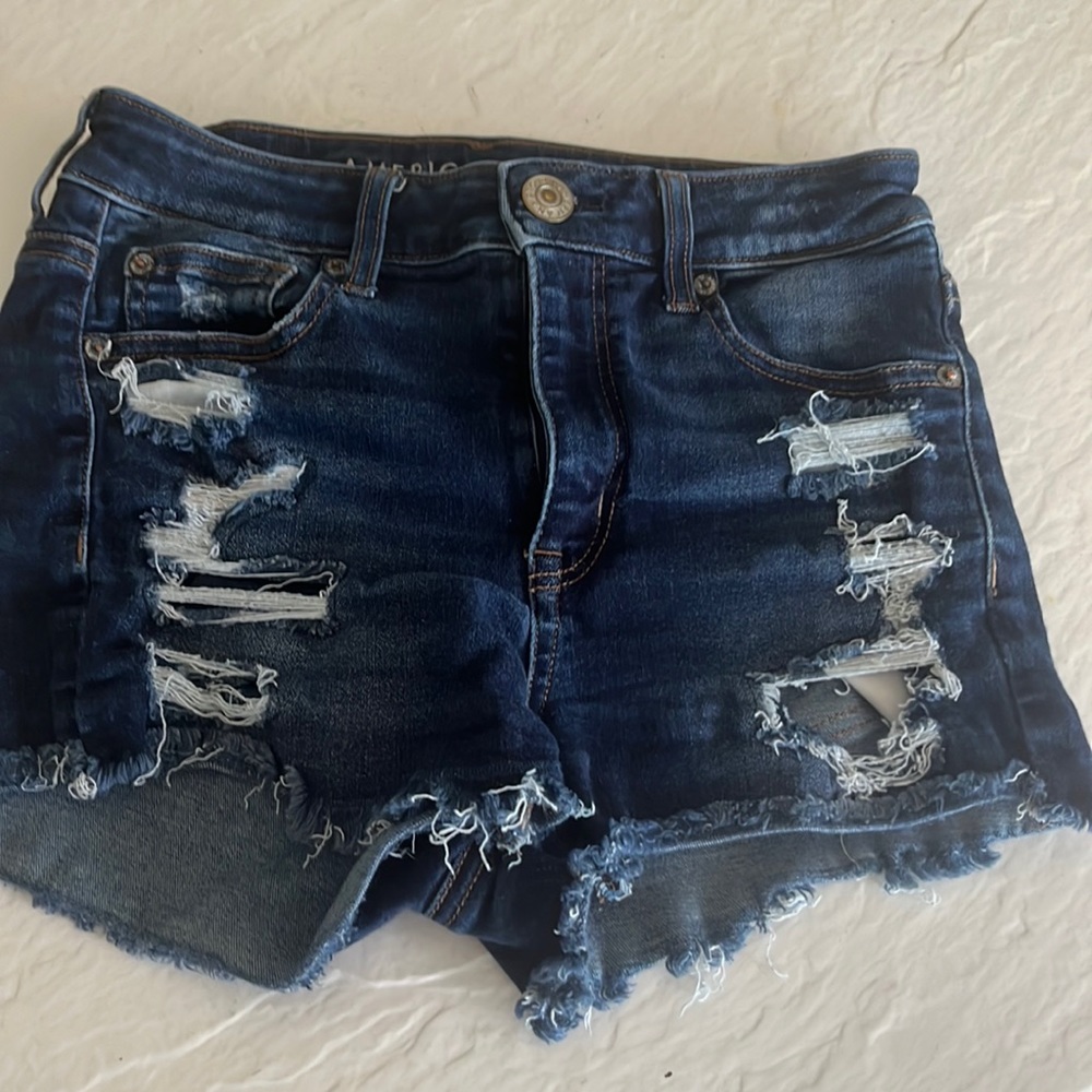 dark blue jean shorts with rips in perfect condition